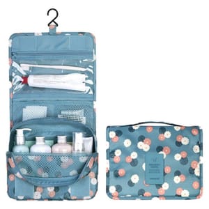 Two hanging toiletry bags are shown, one open displaying compartments and bottles, in a blue floral pattern, and the other closed.