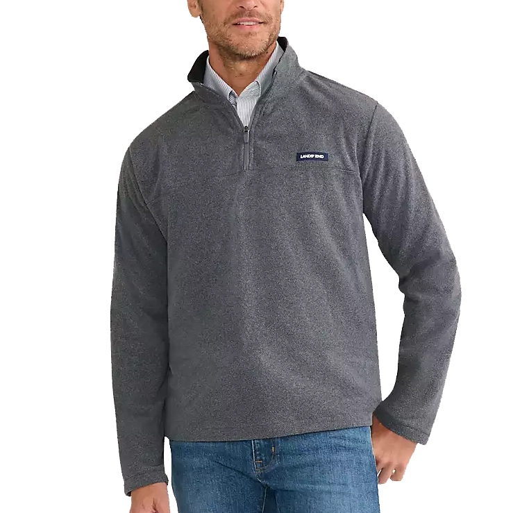 A man is wearing a gray quarter-zip fleece pullover labeled \“Lands' End,\“ paired with a collared shirt and blue jeans.