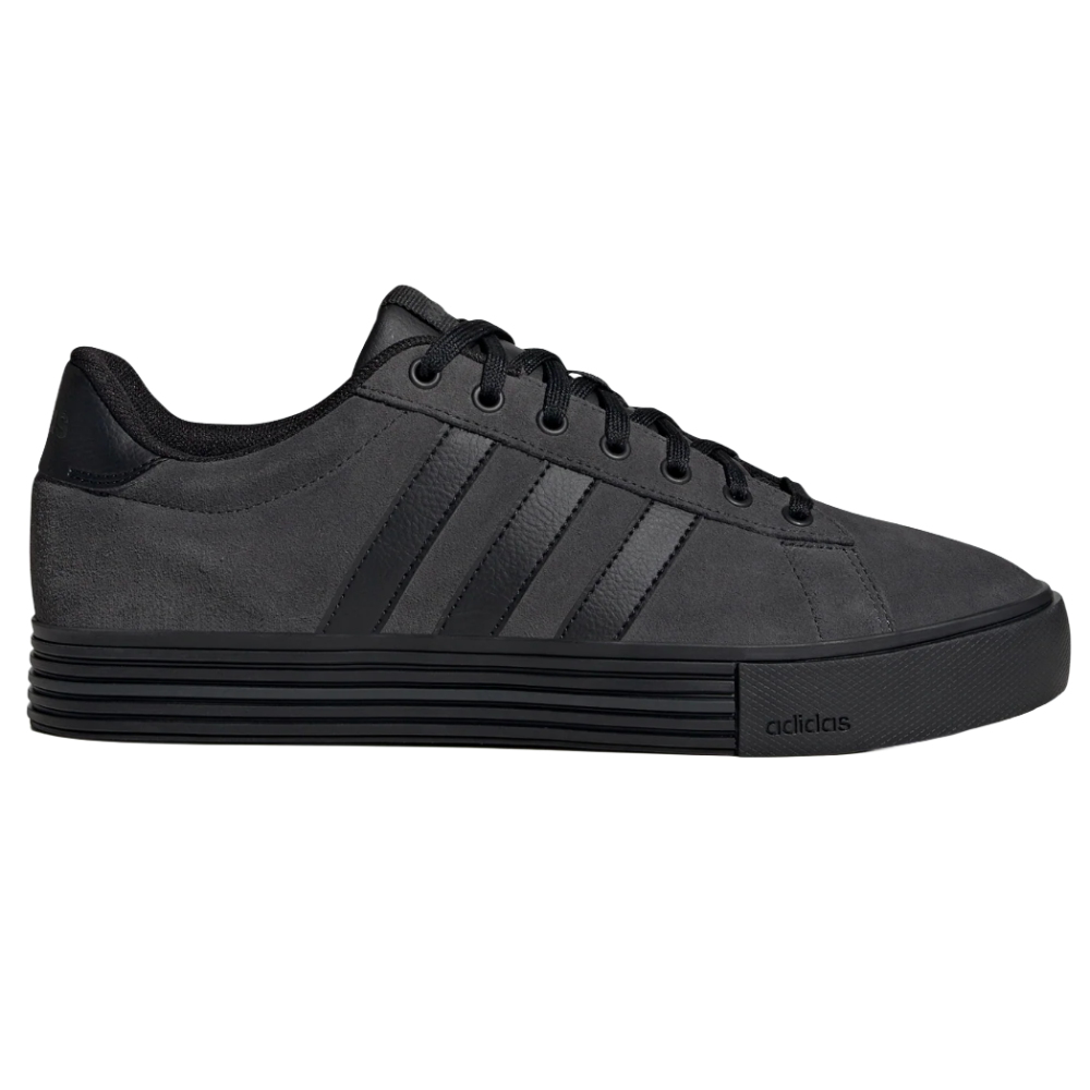 A black sneaker with a minimalist design, featuring subtle textured stripes and a sleek rubber sole. The shoe has a lace-up closure and a discreet brand logo on the side.