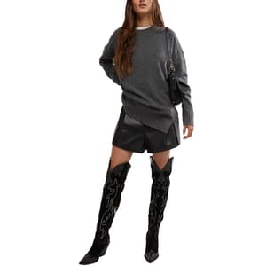 The Free People Phoebe Sweater is a cozy, oversized knit in dark gray with a relaxed fit and long sleeves, featuring ribbed detailing at the cuffs and hem.