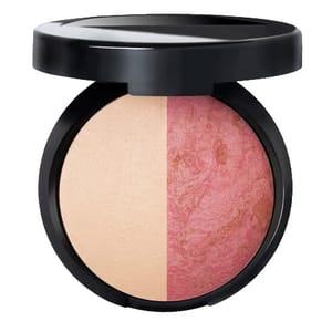 A round compact containing a duo of pressed powders, one side in a neutral beige tone and the other in a marbled pink shade, housed in a black casing.