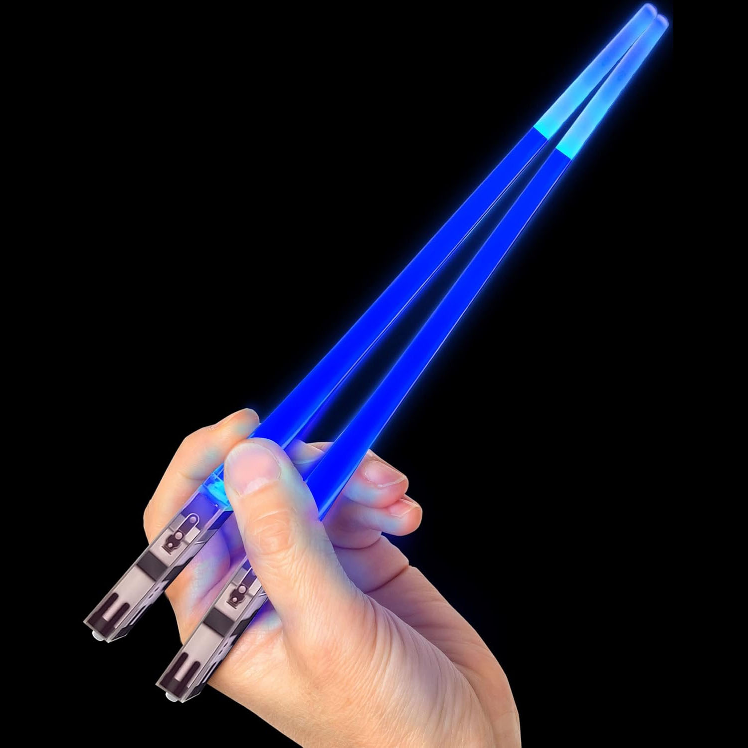 Blue light saber chopsticks are held in a hand, featuring handles designed to resemble the hilts of lightsabers. They emit a bright blue glow along the length of each chopstick.