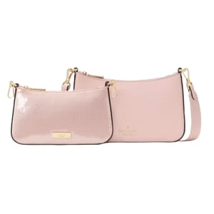 The Kate Spade Satin & Sequin Duet Bag features two pink crossbody bags, one with a smooth satin finish and the other with a shimmery sequin texture. Both have gold-tone hardware and detachable straps.