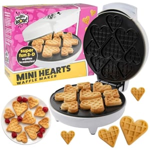 Mini Hearts Waffle Maker creates fun 3D waffles in heart shapes, with a non-stick surface for cooking multiple waffles at once. The box is pink and yellow with images of the waffles and the maker.