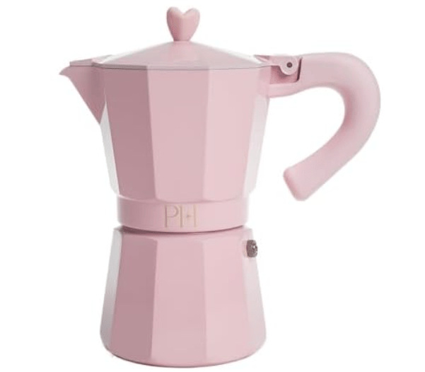 A pink Moka pot with a heart-shaped knob and a curved handle, designed for making stovetop espresso.