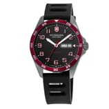 A Victorinox Swiss Army watch with a black dial, white and red markers, red bezel, and a day-date window. It has a black rubber strap and a stainless steel case.