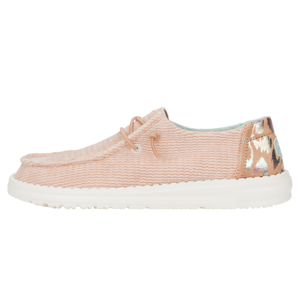 Wendy Corduroy Leo Shoes are casual, slip-on sneakers in a soft blush color with a textured upper, white sole, and decorative lacing. The back features a multicolored leopard print accent.