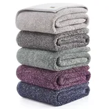 A stack of five folded towels in varying colors—light grey, dark grey, green, purple, and dark blue.