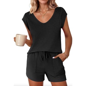 A black women's loungewear set featuring a short-sleeve V-neck top and drawstring shorts with pockets. The outfit is paired with a simple necklace and bracelets.