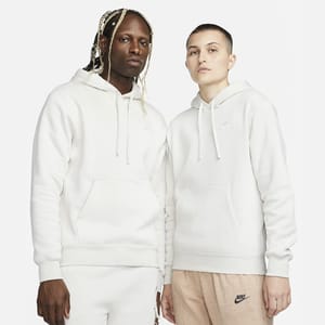 Two people wearing white hoodies with a small Nike logo on the front.