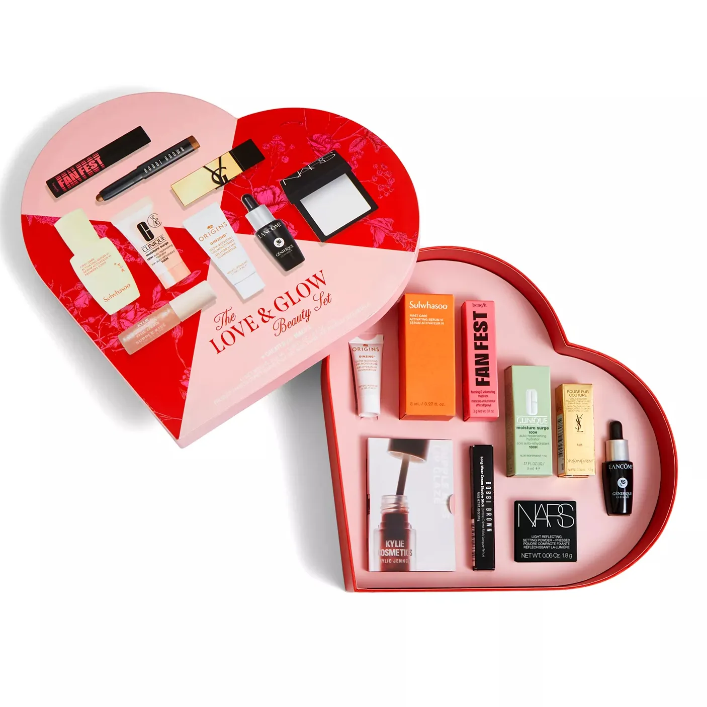 Heart-shaped beauty set featuring Sulwhasoo serum, Origins cream, Kylie Cosmetics liquid blush, Benefit primer, Clinique moisturizer, YSL lipstick, NARS bronzer, Lancôme serum, and Bobbi Brown mascara.