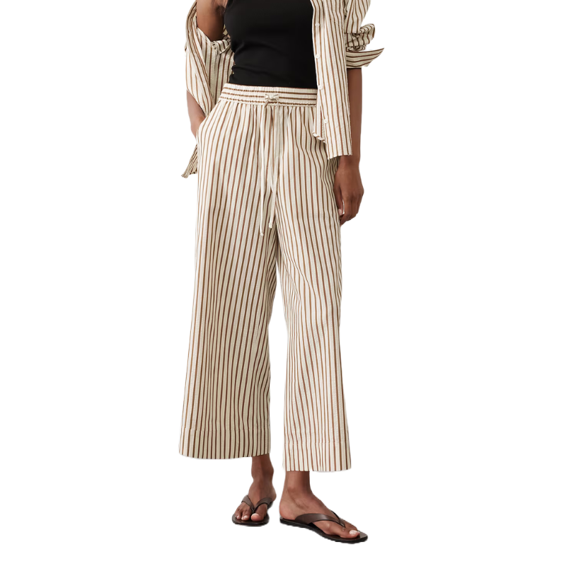 Seersucker Cropped Pull-On Pants feature beige and brown vertical stripes, an elastic waistband with a drawstring, and a relaxed wide-leg fit.