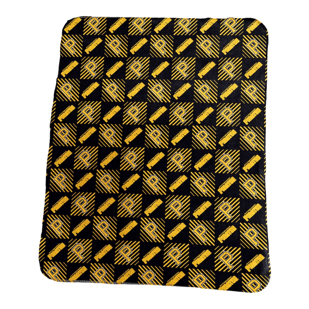 A black and yellow patterned blanket featuring a repeating design of a letter \“R\“ and a stylized stripe pattern arranged in alternating squares.