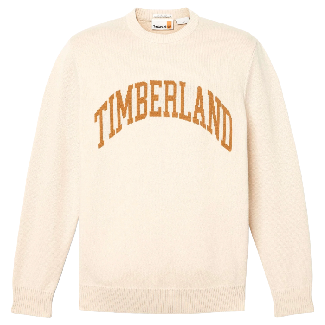 A beige sweater with the word \“Timberland\“ in bold, arched brown letters across the front. It features ribbed cuffs and hem.
