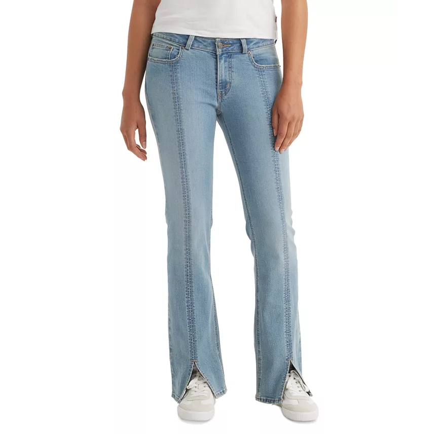 Levi's Seamed Superlow Bootcut Jeans feature a light blue wash with distinct vertical seams and a subtle flare at the hem. They have a low-rise fit and front slits at the bottoms, paired with a classic five-pocket design.