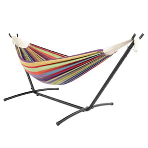 A multicolored striped hammock attached to a black metal stand.