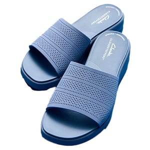 Blue Clarks Drift Twist Slide Sandals featuring perforated straps and a slip-on design. They offer comfort with a cushioned footbed and have a wide fit.
