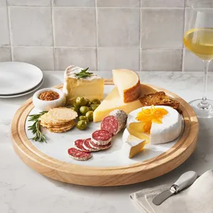 A charcuterie board with assorted cheeses, salami slices, crackers, olives, mustard, and a glass of white wine.