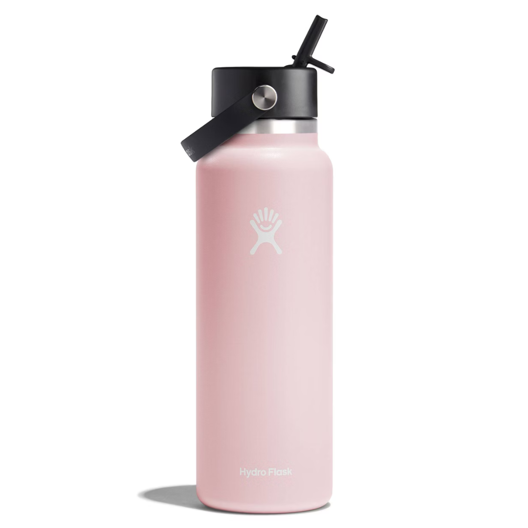 A pink Hydro Flask bottle with a black cap and straw, featuring the Hydro Flask logo.