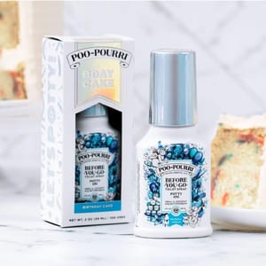 Poo-Pourri Birthday Cake scented before-you-go toilet spray in packaging and bottle next to a slice of cake.