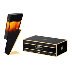 Carolina Herrera Bad Boy Elixir Eau de Parfum, featuring a lightning bolt-shaped bottle alongside a black and gold accent box, 150 ml (5.1 FL.OZ).