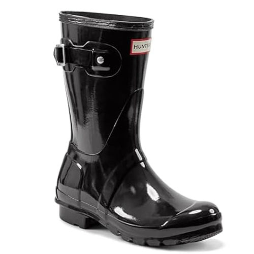 Black glossy rubber rain boot with a buckle and a label that reads \“Hunter\“.
