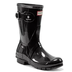 Black glossy rubber rain boot with a buckle and a label that reads \“Hunter\“.