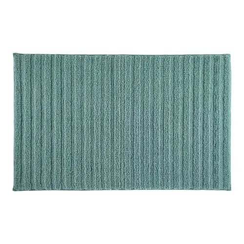 A rectangular, textured bath mat with a ribbed pattern in a teal color.