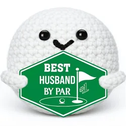 A crocheted white ball character with a smiling face holds a green sign reading \“Best Husband by Par\“ with a golf flag design.