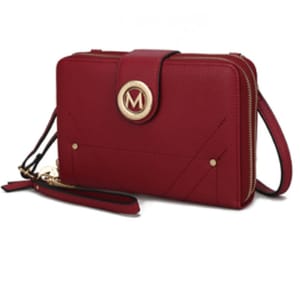 A red wristlet with a shoulder strap, featuring a gold circular emblem with the letter \“M,\“ and secure zippered compartments.