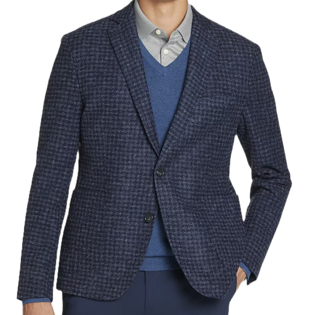 A navy houndstooth sportcoat with a two-button front, notch lapel, and welt pockets, layered over a blue sweater and light gray shirt.
