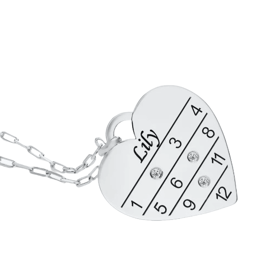 Heart-shaped pendant with a grid numbered 1-12, featuring rhinestones on numbers 3, 7, and 9, and the name \“Lily\“ engraved above.