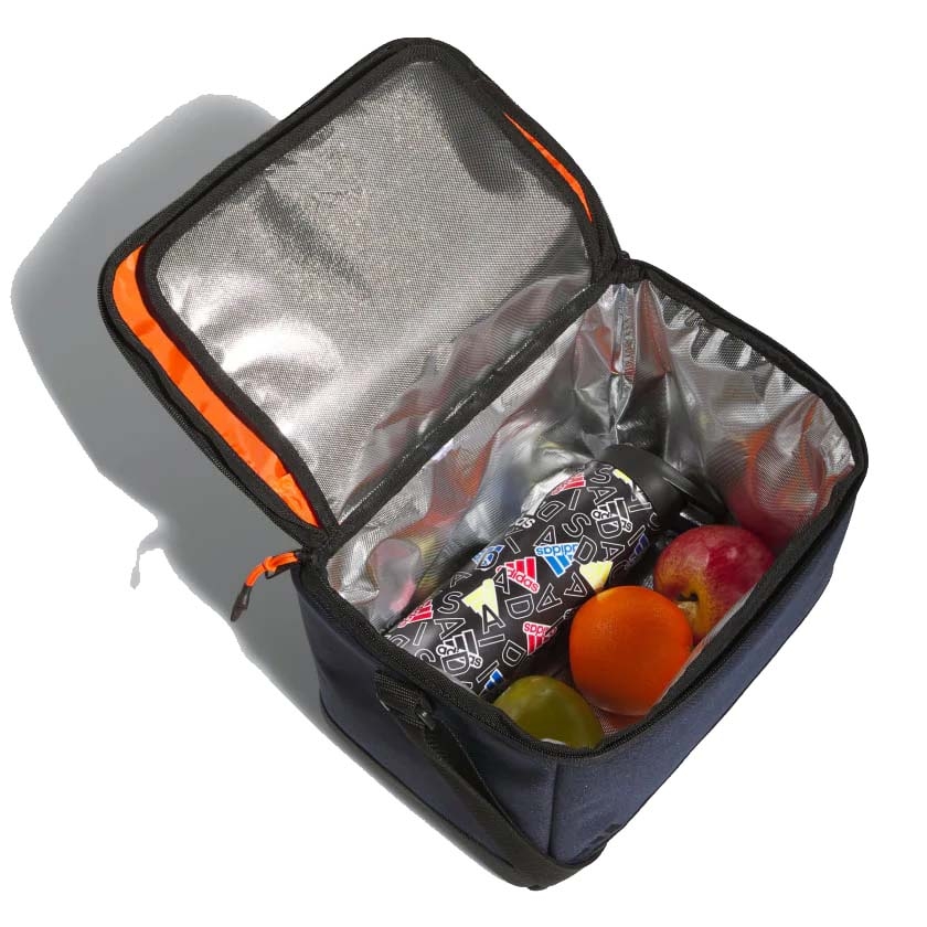 Insulated lunch box with orange trim, holding a patterned thermos and fruits: an apple, orange, and grape.