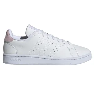 White Adidas sneaker with perforated stripes and pink detail on the heel.