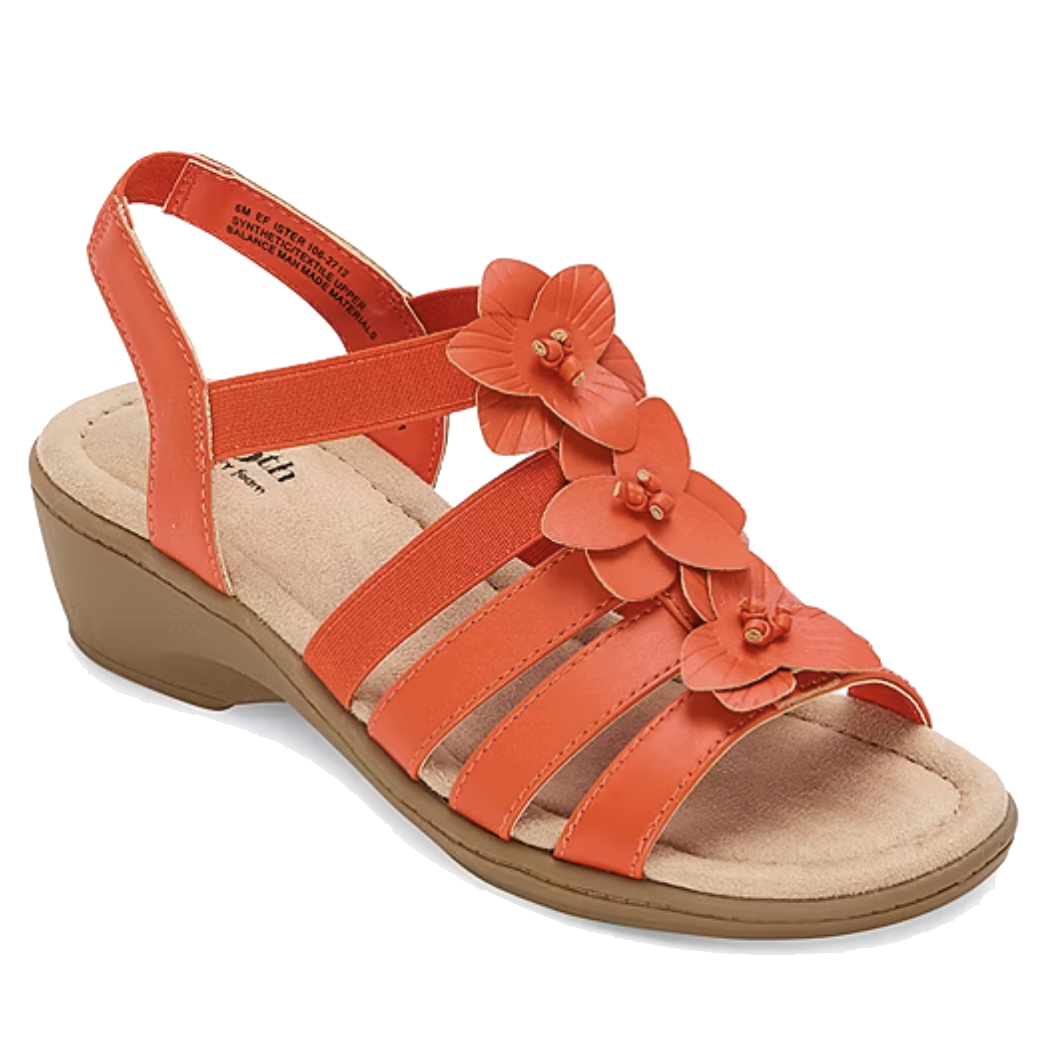 Orange sandal with a wedge heel featuring three floral embellishments and multiple straps, with an elastic back strap for support.