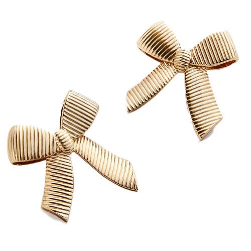 A pair of gold bow-shaped earrings.