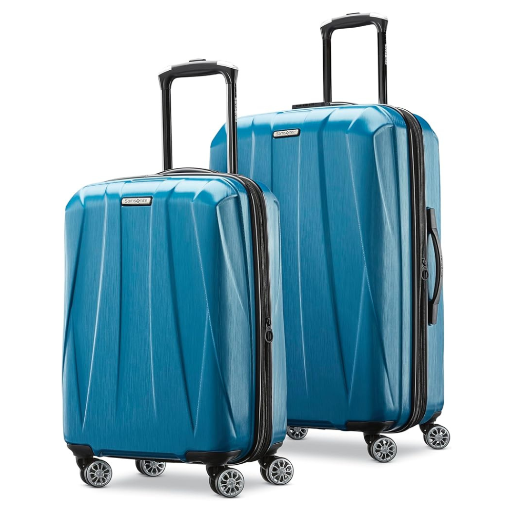 Two blue hard-shell suitcases with textured surfaces, featuring telescopic handles and four spinner wheels each.