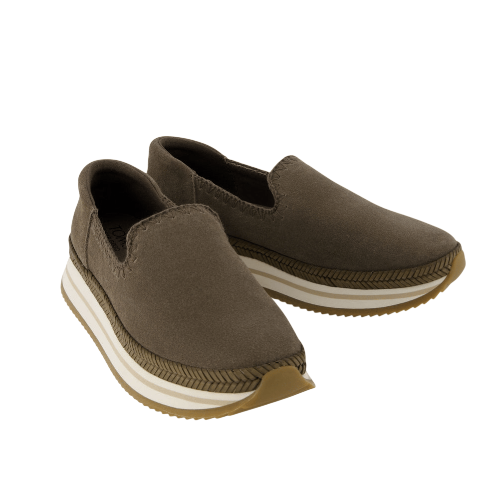 Brown slip-on shoes with a chunky, white-striped platform sole and a textured toe.