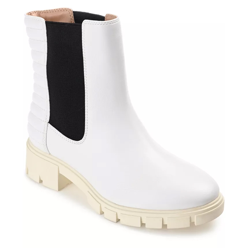 Journee Tatiana Stretch Gore booties feature a white exterior with black stretch panels for easy wear, quilted detailing at the back, and a chunky beige sole for durability and style.