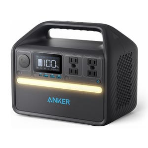 Portable power station with an LCD display, four AC outlets, multiple USB ports, and a car socket. It features a carrying handle and an integrated LED light strip.