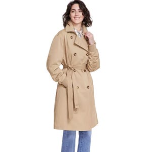 A beige Karl Lagerfeld trench coat featuring a double-breasted design, waist tie belt, and button details, paired with blue jeans.