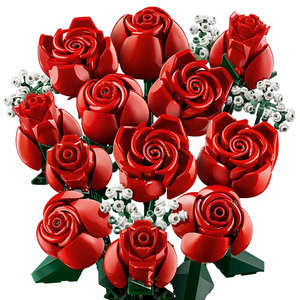 Lego 822-piece Roses Bouquet Set features vibrant red roses with green stems and small white flower accents, creating a striking display made entirely of Lego bricks.