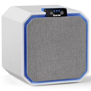 A Costway desktop HEPA air purifier with a cubic design features a fabric-covered front, blue LED strip, and a control panel with power and air flow buttons, along with LED indicators on top.