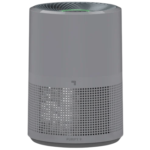 A gray cylindrical air purifier with a perforated lower section for air intake.