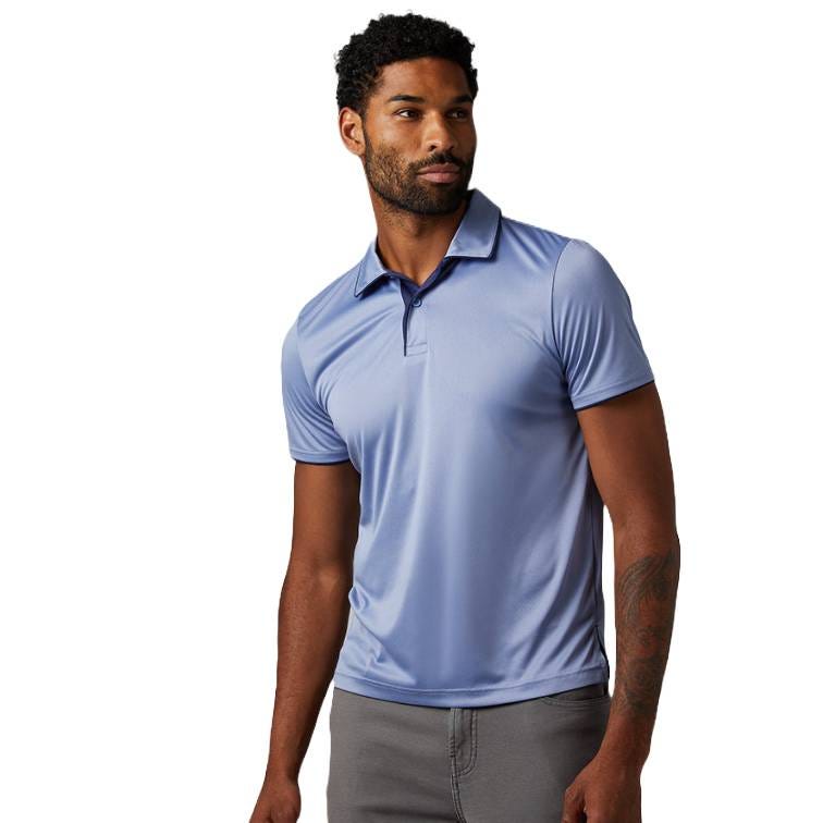 A man is wearing a light blue short-sleeve polo shirt paired with gray pants.