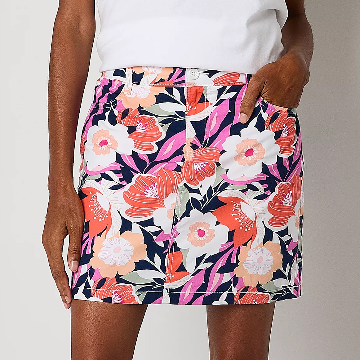Floral-patterned skirt with a mix of pink, orange, and white flowers on a navy background.