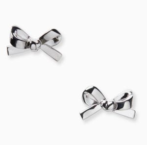 Silver bow-shaped stud earrings with a polished finish.