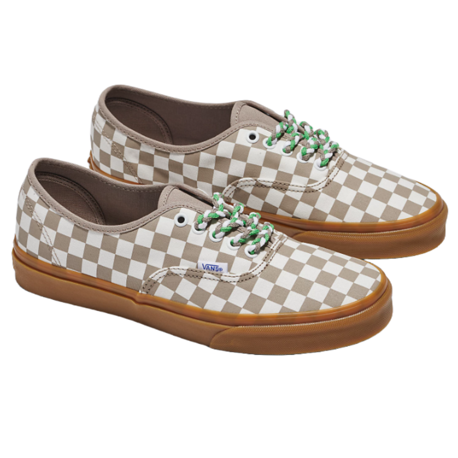 A pair of Vans checkerboard sneakers with brown and white squares and green laces.