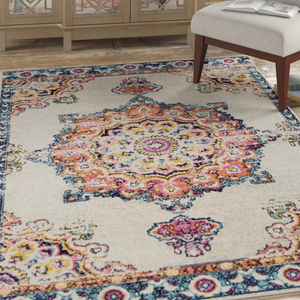 An 8' x 10' area rug featuring a vibrant medallion design with intricate patterns in orange, pink, yellow, and blue on a light background, bordered by a detailed floral motif in coordinating colors.