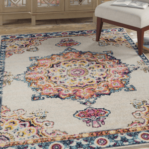 An 8' x 10' area rug featuring a vibrant medallion design with intricate patterns in orange, pink, yellow, and blue on a light background, bordered by a detailed floral motif in coordinating colors.